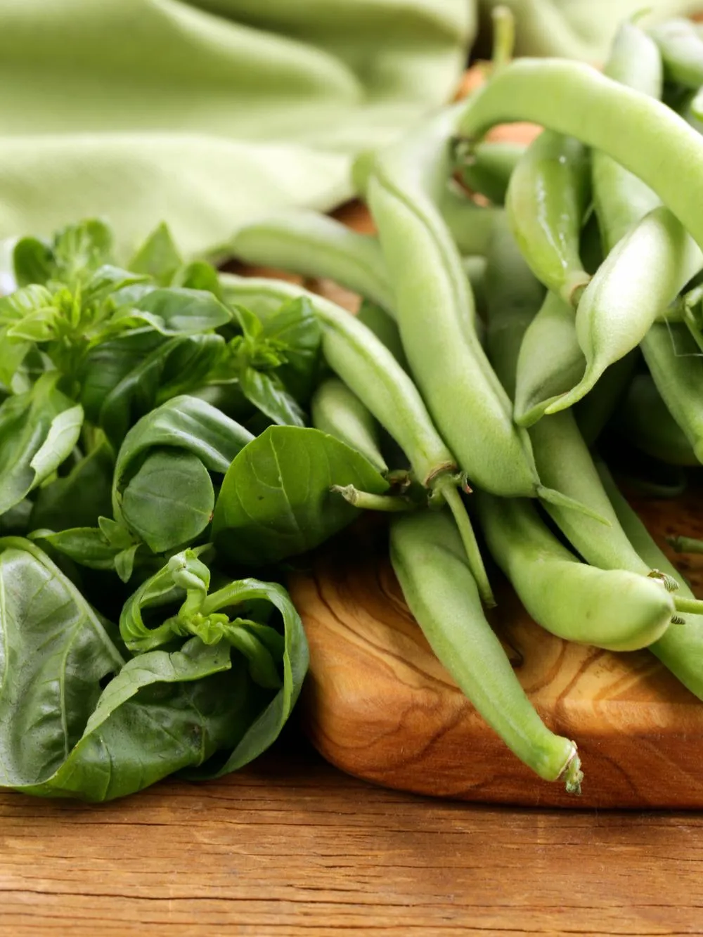fresh green beans for our asian chicken and green bean stir fry on a cutting board
