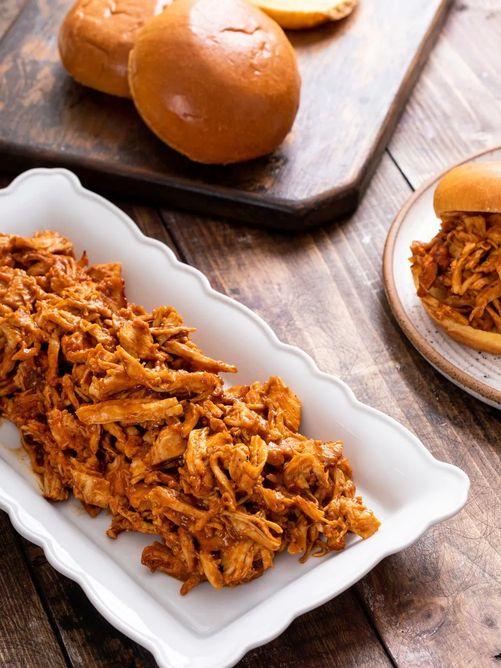 Shredded bbq chicken cooking in a crockpot